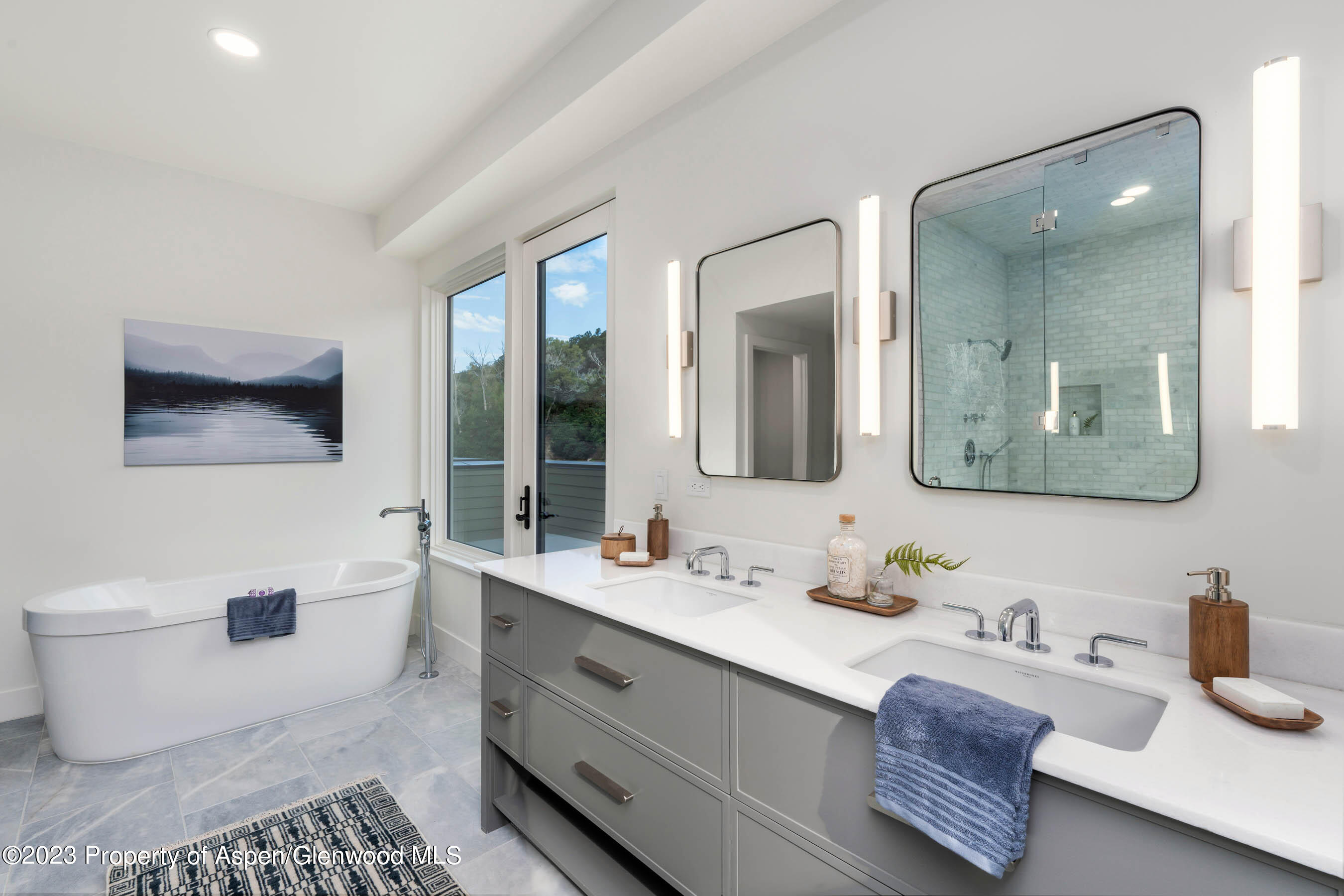 22840 Two Rivers Road, Unit 300 Basalt, CO 81621 - Photo 17 of 28 a bathroom with a sink mirror and a toilet