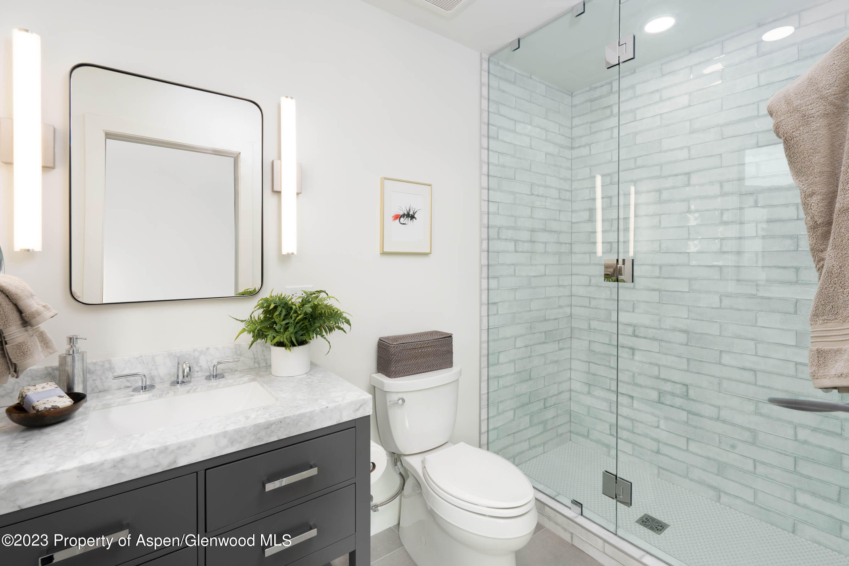 22840 Two Rivers Road, Unit 300 Basalt, CO 81621 - Photo 25 of 28 a bathroom with a granite countertop sink toilet and shower