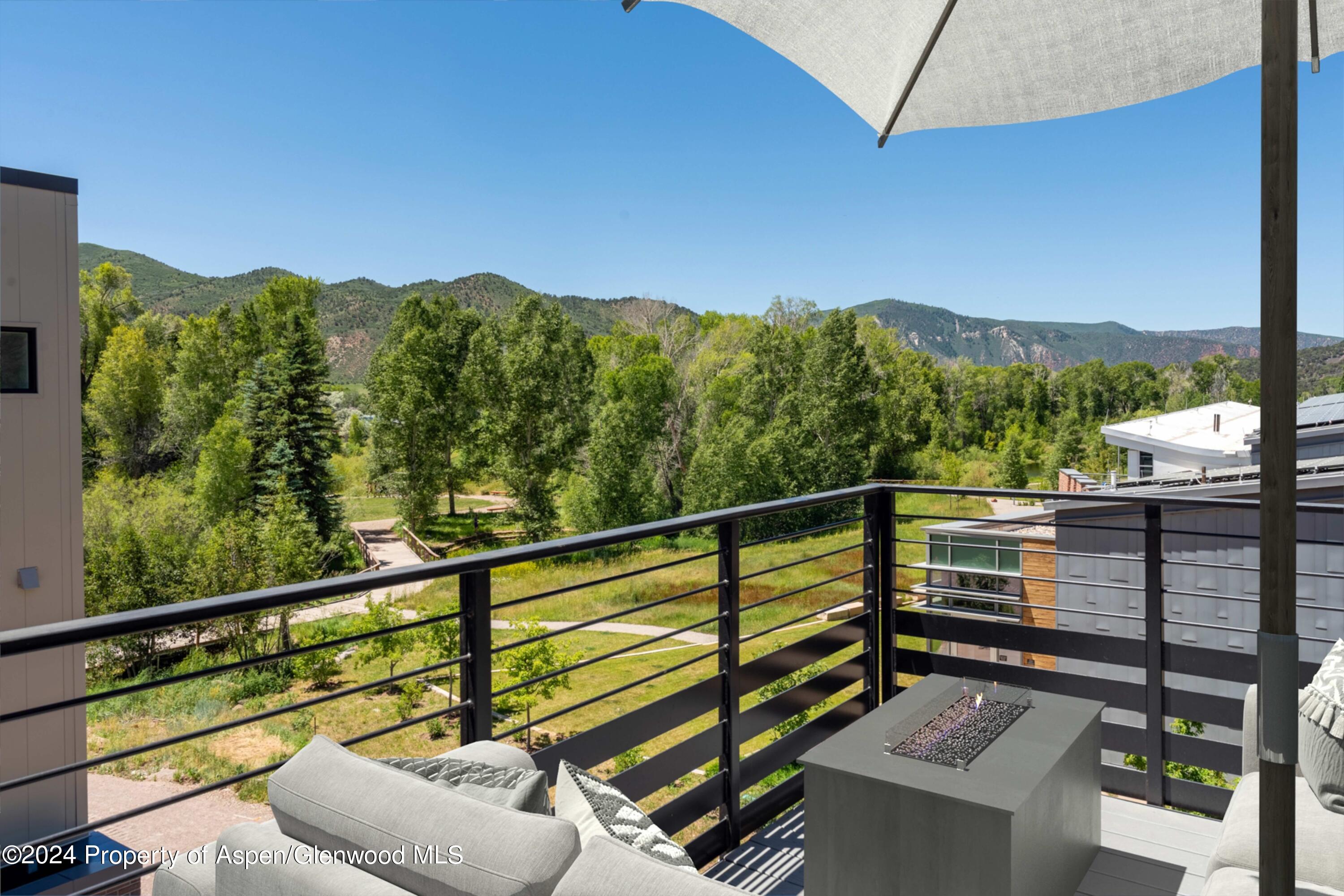 22840 Two Rivers Road, Unit 300 Basalt, CO 81621 - Photo 5 of 28 a view of a balcony with mountain view and a floor