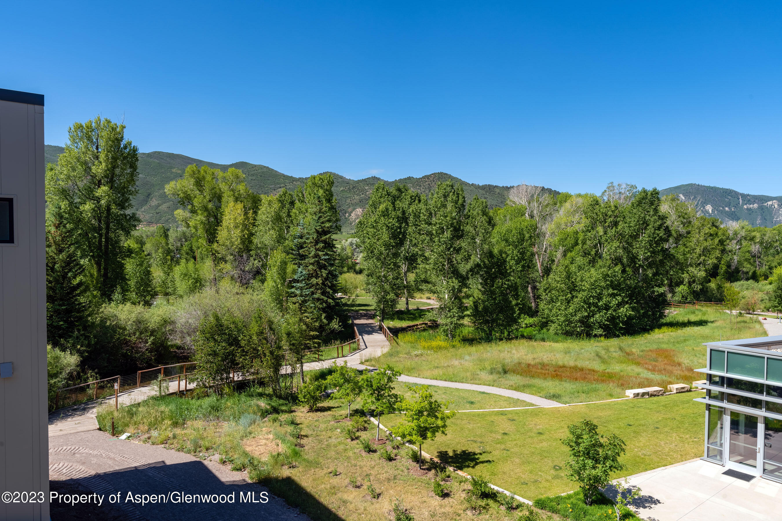 22840 Two Rivers Road, Unit 300 Basalt, CO 81621 - Photo 6 of 28 a view of a swimming pool with a yard