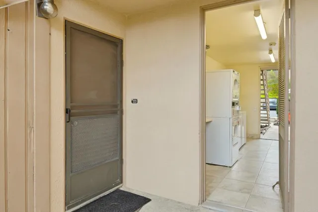 a view of a bathroom from a hallway