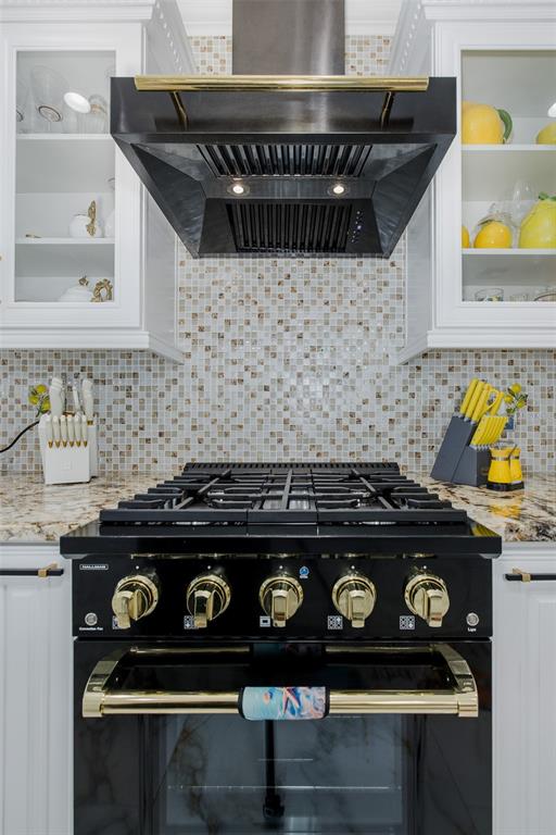 3271 Hibiscus Drive Hernando Beach, FL 34607 - Photo 41 of 95 a close view of a stove a microwave and cabinets