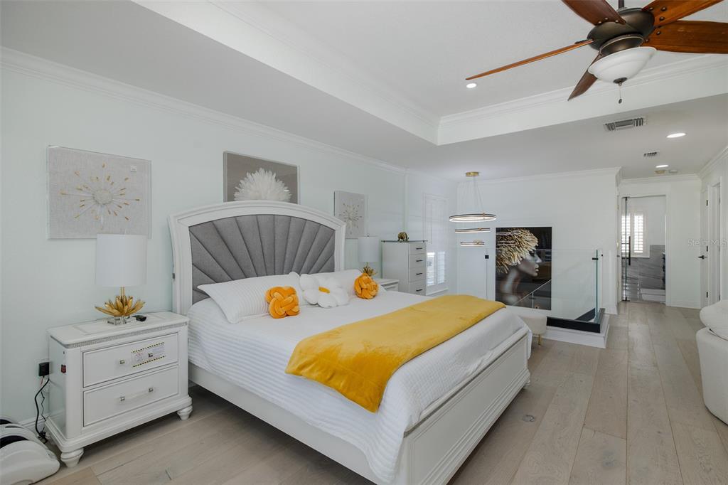 3271 Hibiscus Drive Hernando Beach, FL 34607 - Photo 50 of 95 a bedroom with a bed and a couch