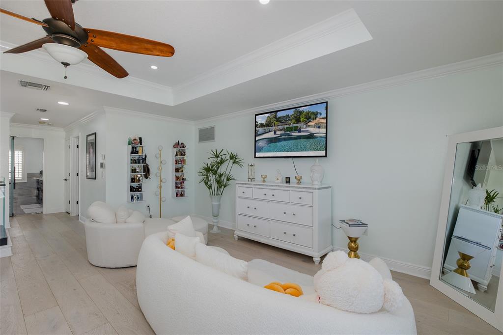 3271 Hibiscus Drive Hernando Beach, FL 34607 - Photo 51 of 95 a spacious bedroom with a bed and a couch