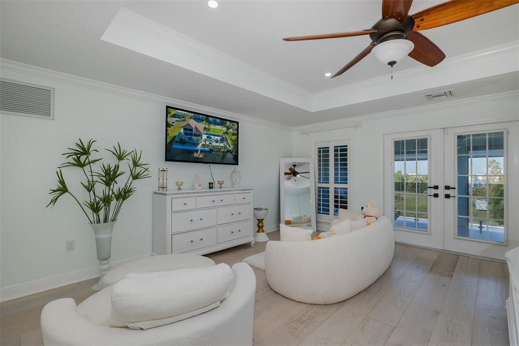 3271 Hibiscus Drive Hernando Beach, FL 34607 - Photo 52 of 95 a living room with furniture and a flat screen tv