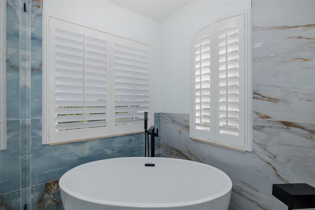 3271 Hibiscus Drive Hernando Beach, FL 34607 - Photo 60 of 95 a bathroom with a bathtub and a sink