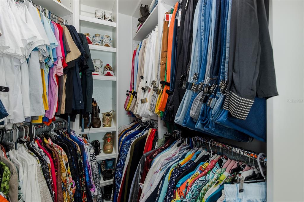 3271 Hibiscus Drive Hernando Beach, FL 34607 - Photo 61 of 95 a view of walk in closet with clothes