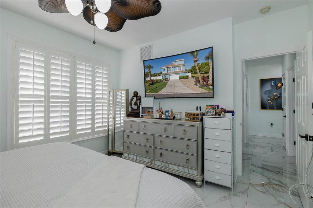 3271 Hibiscus Drive Hernando Beach, FL 34607 - Photo 64 of 95 a bedroom with a bed and a flat screen tv