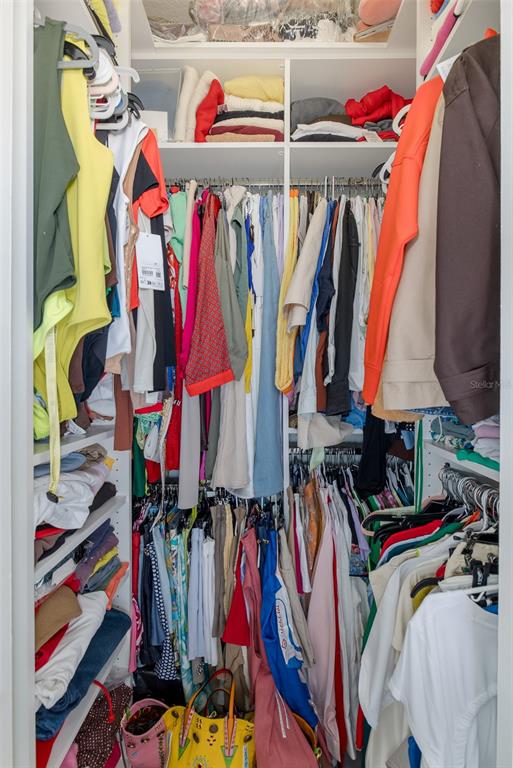 3271 Hibiscus Drive Hernando Beach, FL 34607 - Photo 65 of 95 a view of walk in closet with clothes and shoes