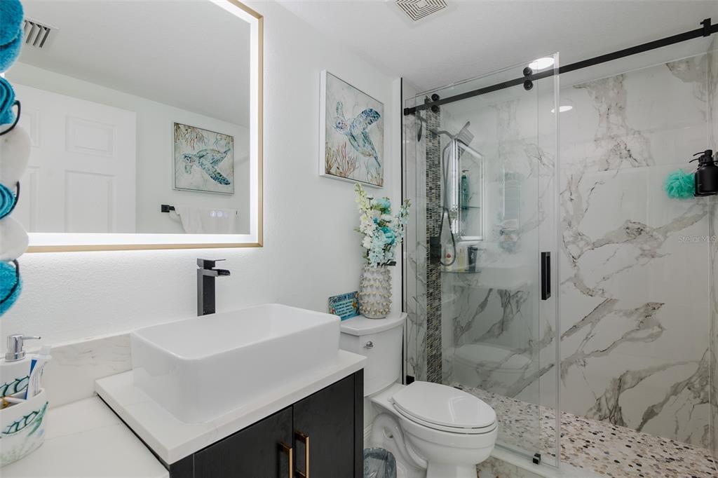 3271 Hibiscus Drive Hernando Beach, FL 34607 - Photo 68 of 95 a bathroom with a sink toilet and shower