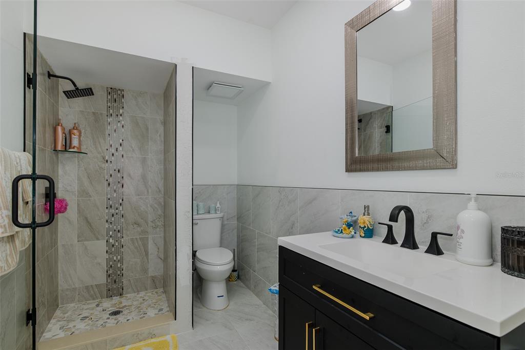 3271 Hibiscus Drive Hernando Beach, FL 34607 - Photo 74 of 95 a bathroom with a sink a toilet and shower