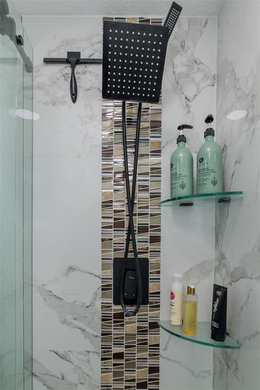 3271 Hibiscus Drive Hernando Beach, FL 34607 - Photo 75 of 95 a bathroom with a shower