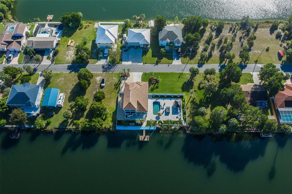 3271 Hibiscus Drive Hernando Beach, FL 34607 - Photo 77 of 95 an aerial view of a house with a yard basket ball court and outdoor seating