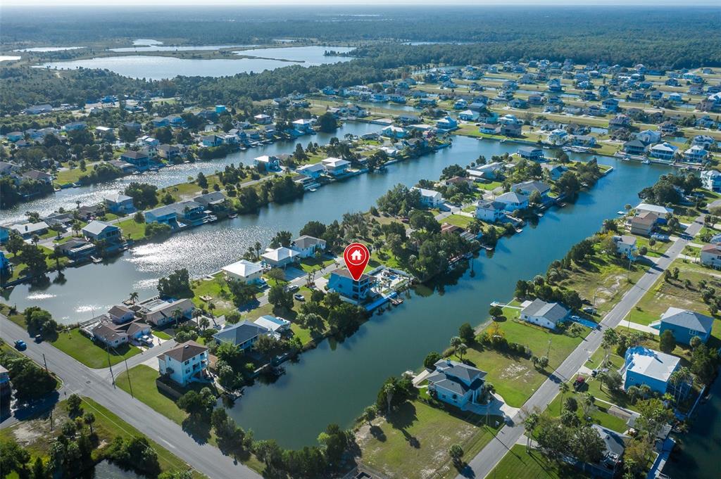 3271 Hibiscus Drive Hernando Beach, FL 34607 - Photo 79 of 95 an aerial view of lake and residential houses with outdoor space