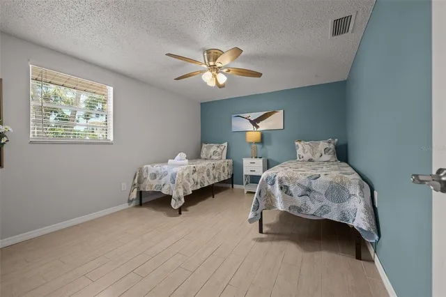 a bedroom with bed and window