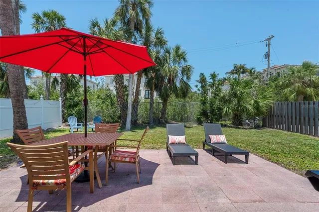 an outdoor space with furniture and umbrella