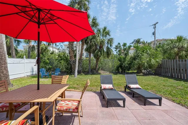 an outdoor space with patio and outdoor seating