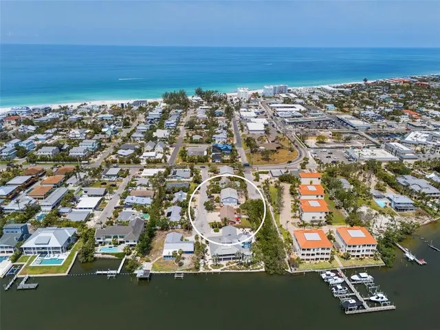 an aerial view of multiple house with outdoor space