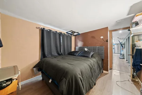 a bed sitting in a bedroom next to a window