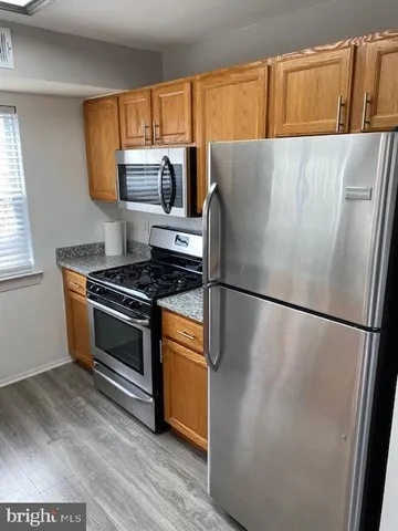 a white refrigerator freezer sitting in a kitchen