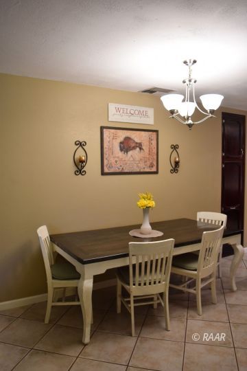 321 East Wilson Avenue Ridgecrest, CA 93555 - Photo 5 of 16 a dining room with furniture and chandelier