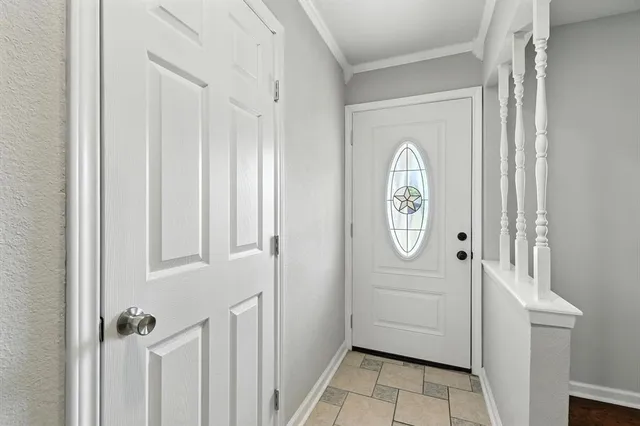 a view of a hallway to rooms