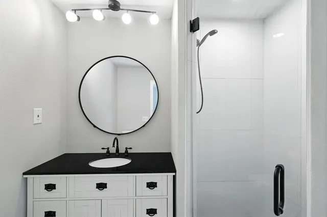 a bathroom with a sink and a mirror