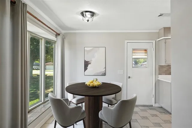 a view of a livingroom with furniture and a table