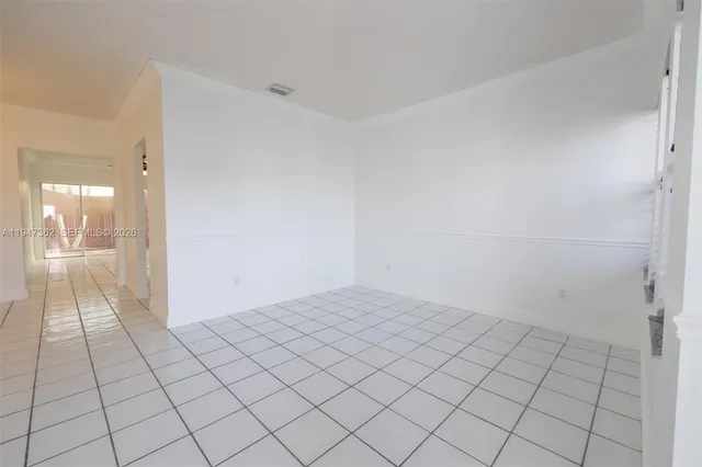 a view of an empty room and window