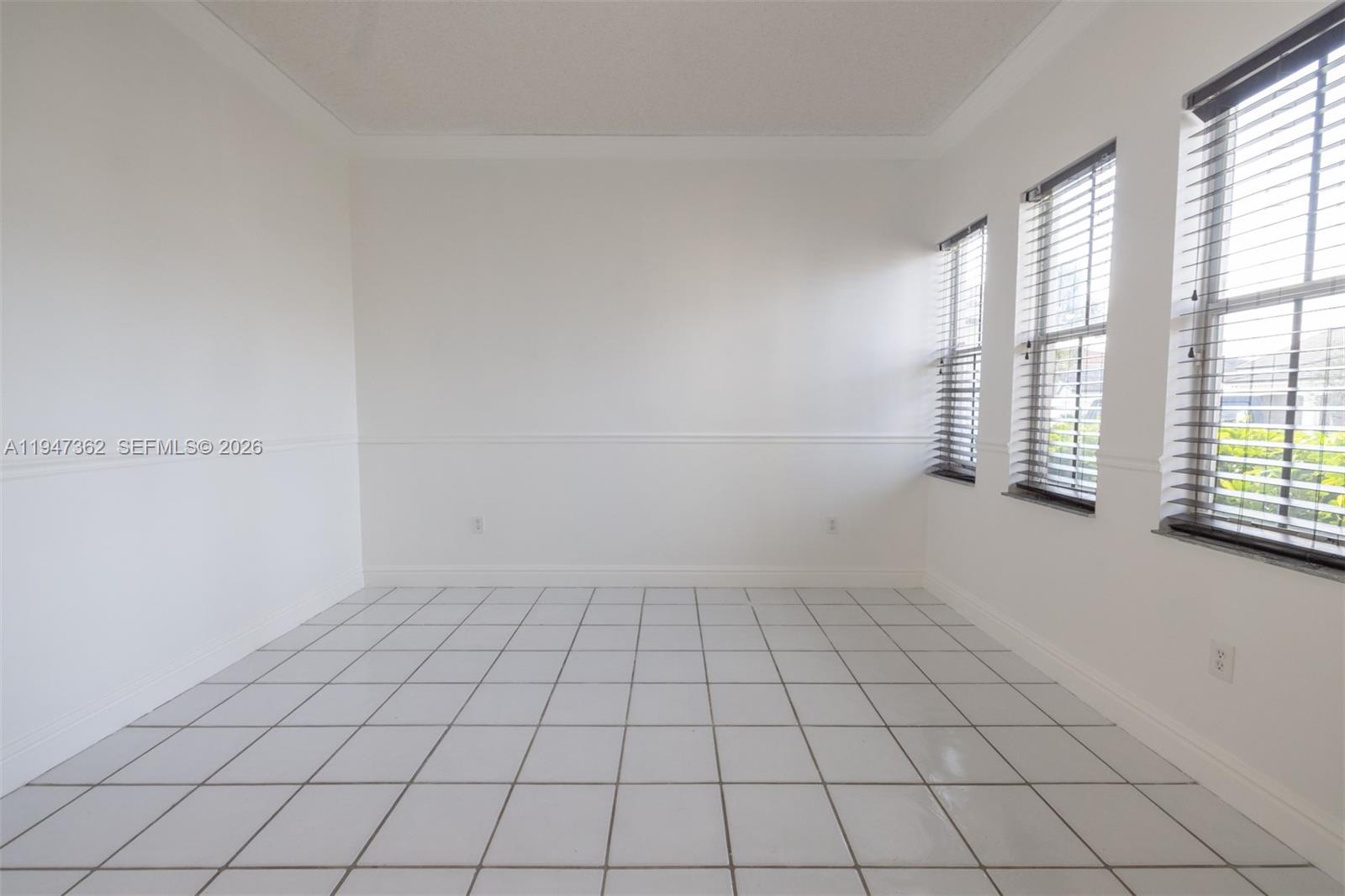 16244 Southwest 81st Street Miami, FL 33193 - Photo 13 of 35 a view of an empty room and window