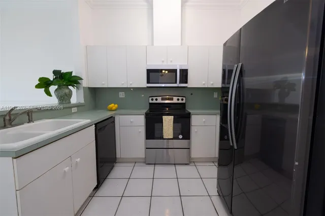 a kitchen with a stove and a microwave