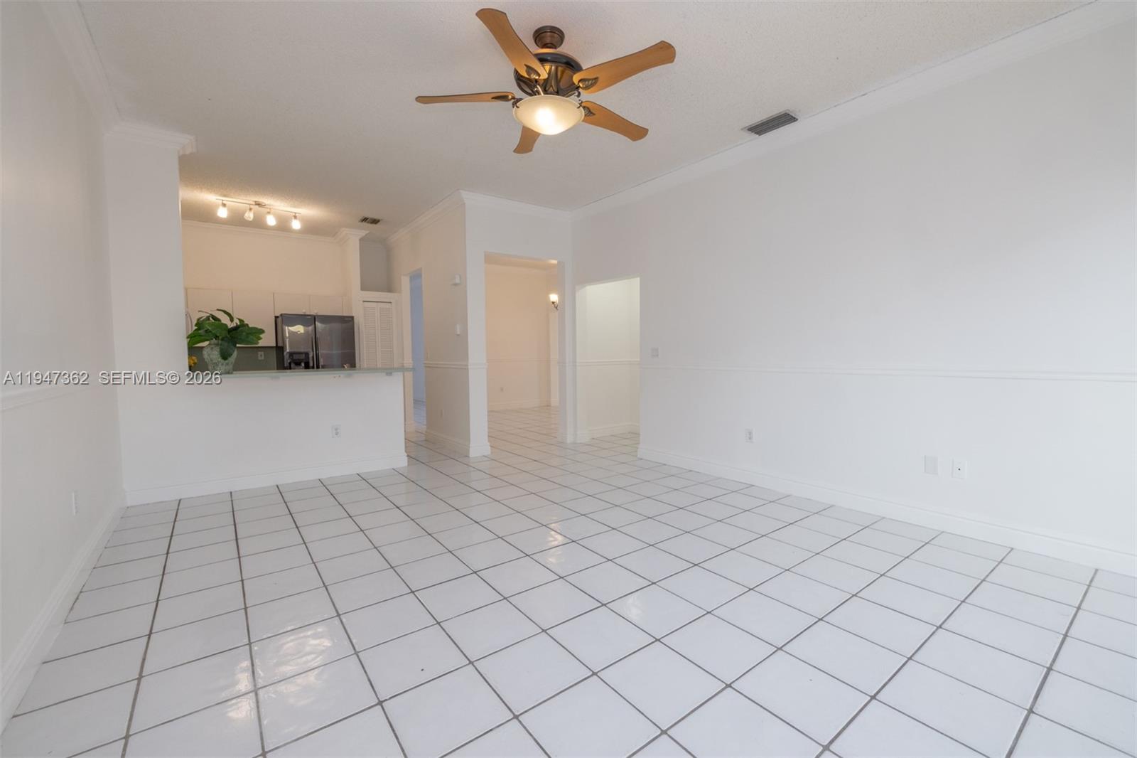 16244 Southwest 81st Street Miami, FL 33193 - Photo 21 of 35 a view of an empty room and chandelier fan