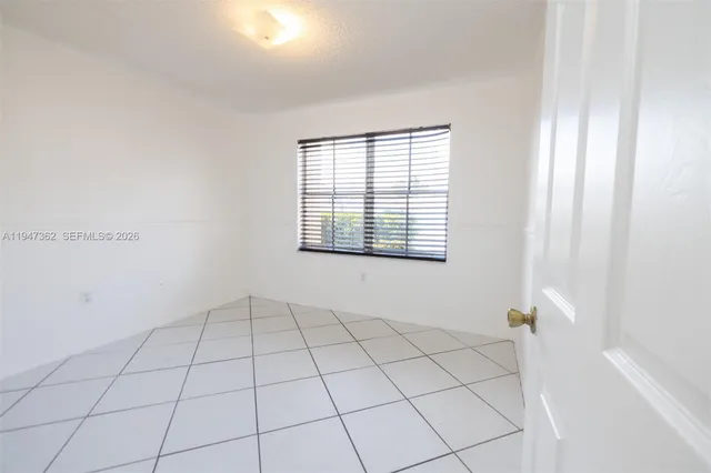 a view of a utility room with wooden floor