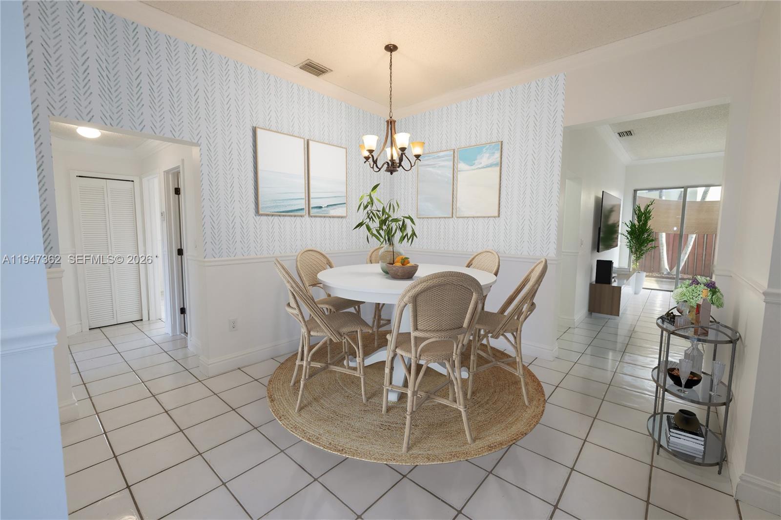 16244 Southwest 81st Street Miami, FL 33193 - Photo 3 of 35 a dining room with furniture and chandelier