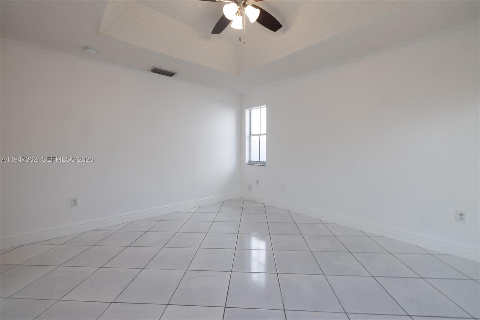 16244 Southwest 81st Street Miami, FL 33193 - Photo 33 of 35 an empty room with chandelier fan