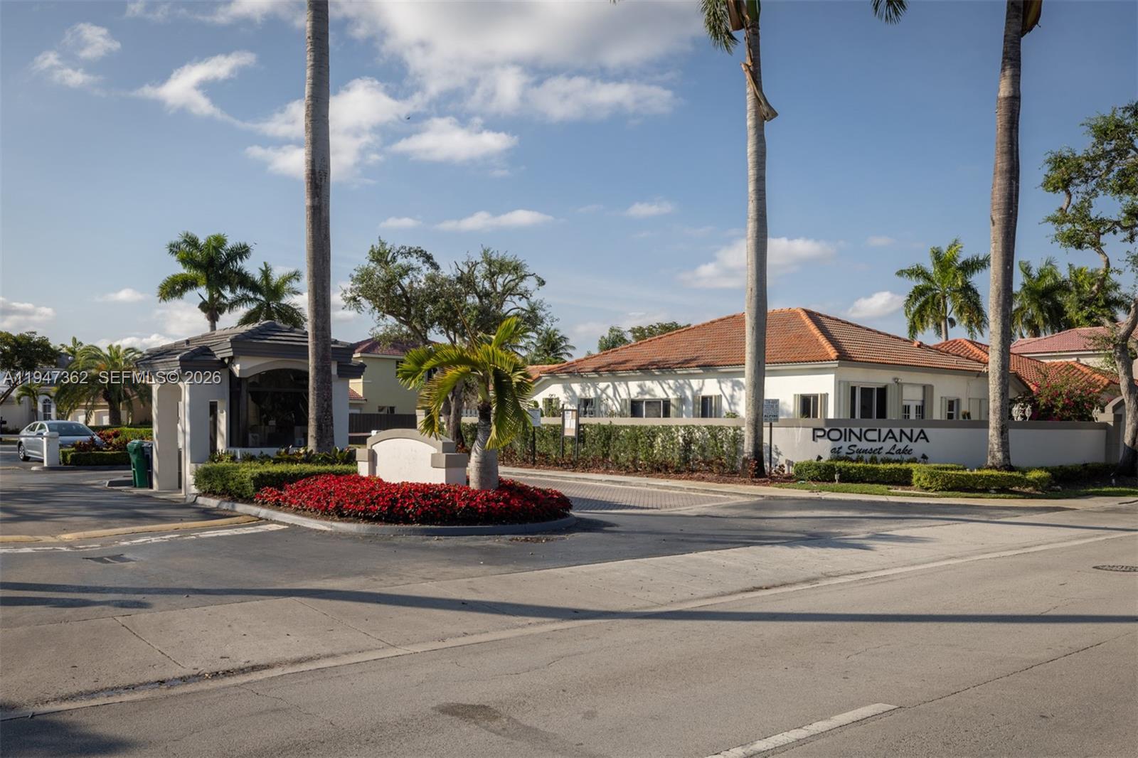 16244 Southwest 81st Street Miami, FL 33193 - Photo 10 of 35 a front view of multi story residential apartment building with yellow lighting
