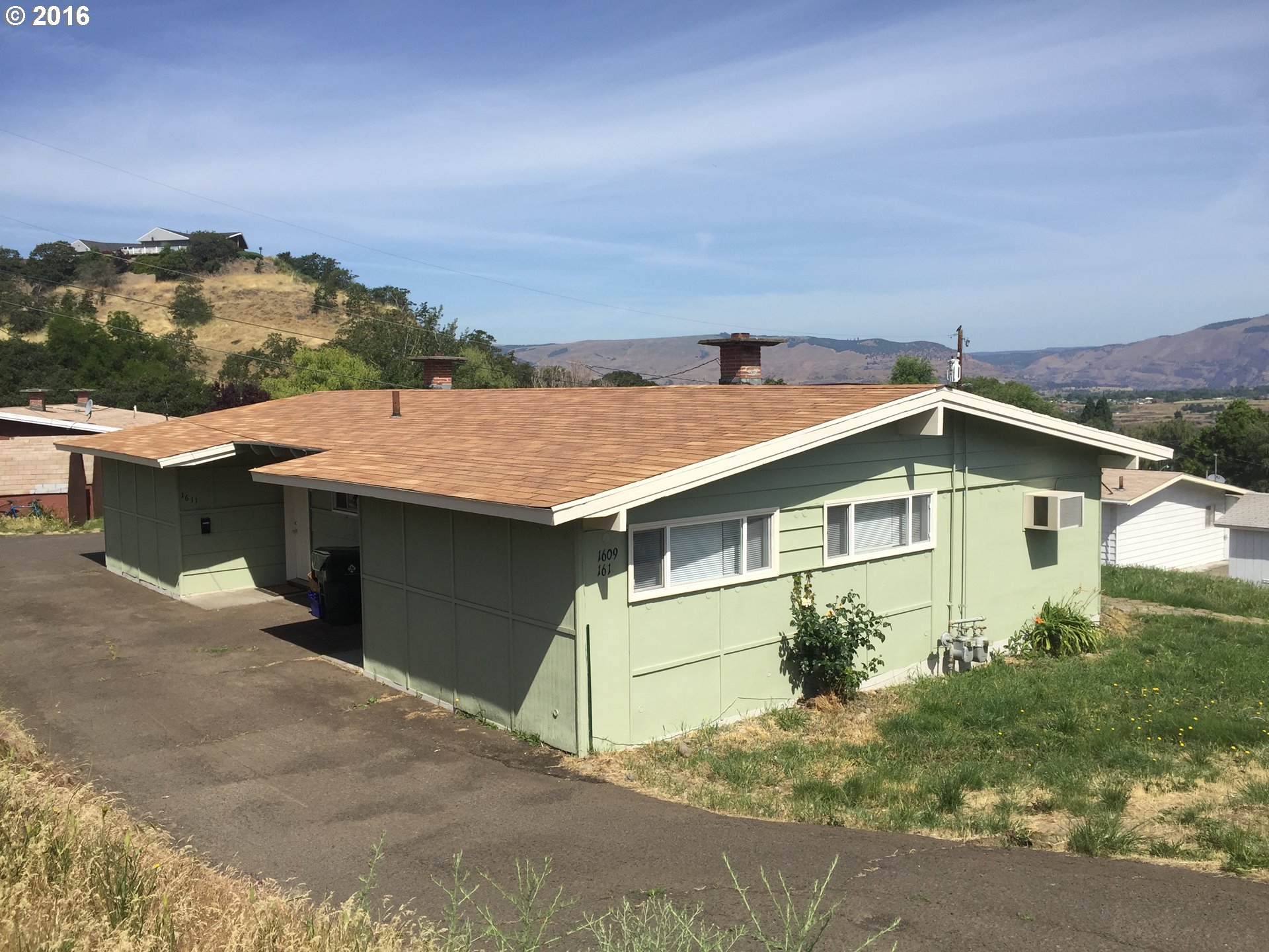 1609 Nevada Street The Dalles, OR 97058 - Photo 1 of 24 a view of a house with a outdoor space