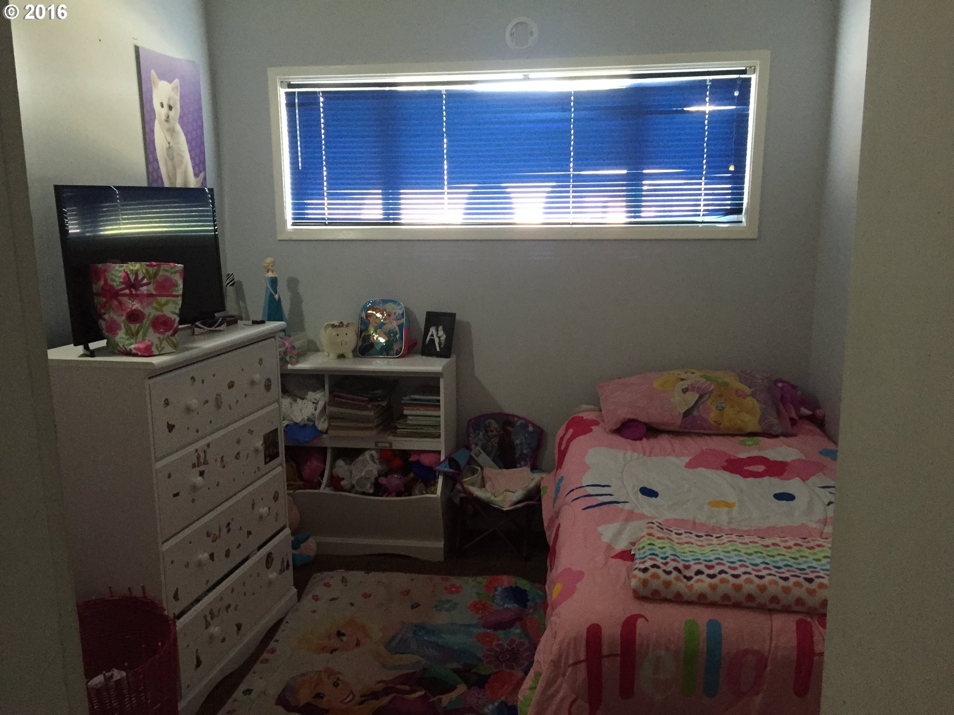 1609 Nevada Street The Dalles, OR 97058 - Photo 12 of 24 a bedroom with a bed and a window