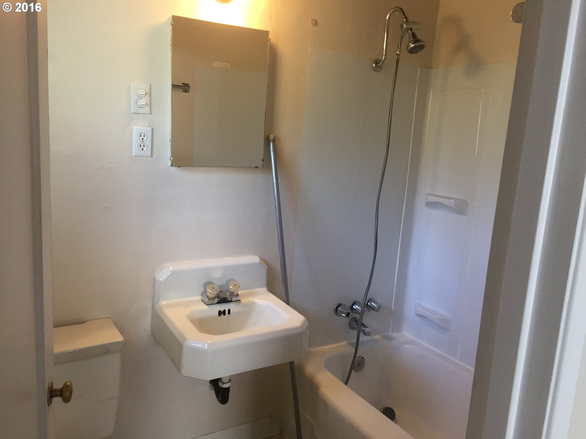 1609 Nevada Street The Dalles, OR 97058 - Photo 19 of 24 a bathroom with a sink a toilet and shower