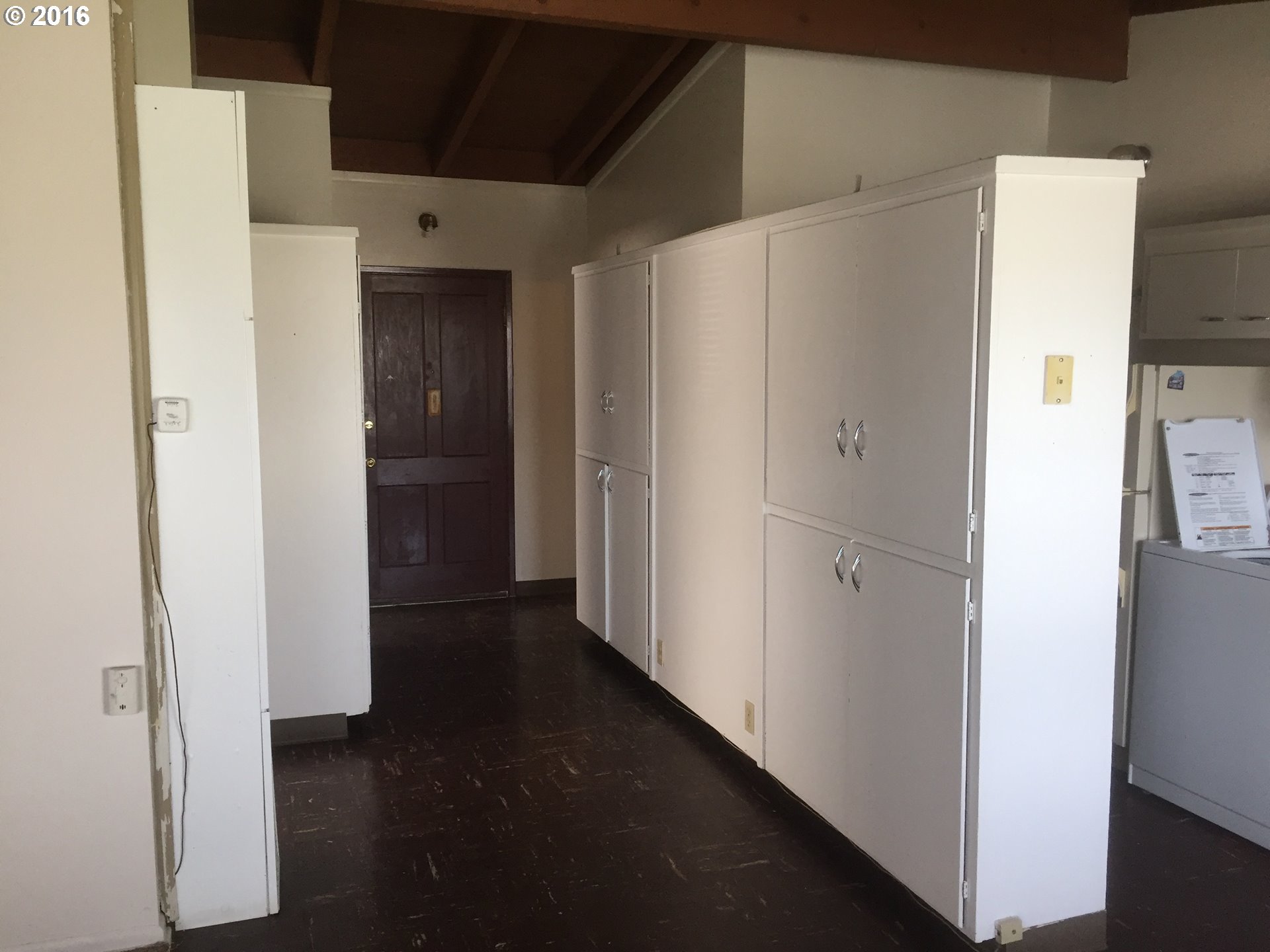 1609 Nevada Street The Dalles, OR 97058 - Photo 23 of 24 a view of a hallway with wooden floor