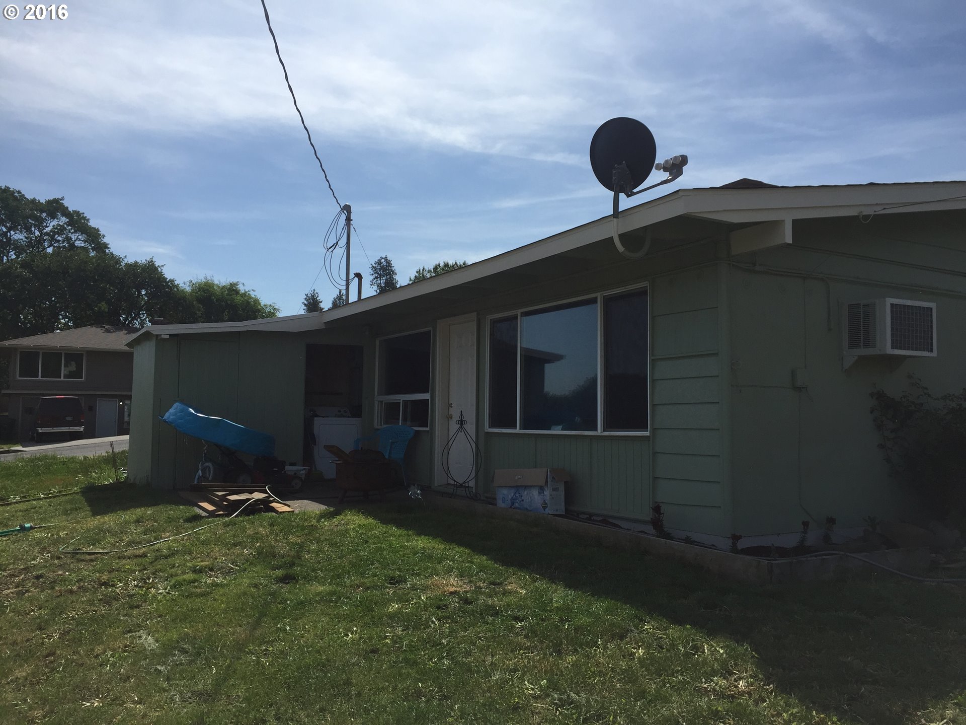 1609 Nevada Street The Dalles, OR 97058 - Photo 3 of 24 a backyard of a house with table and chairs