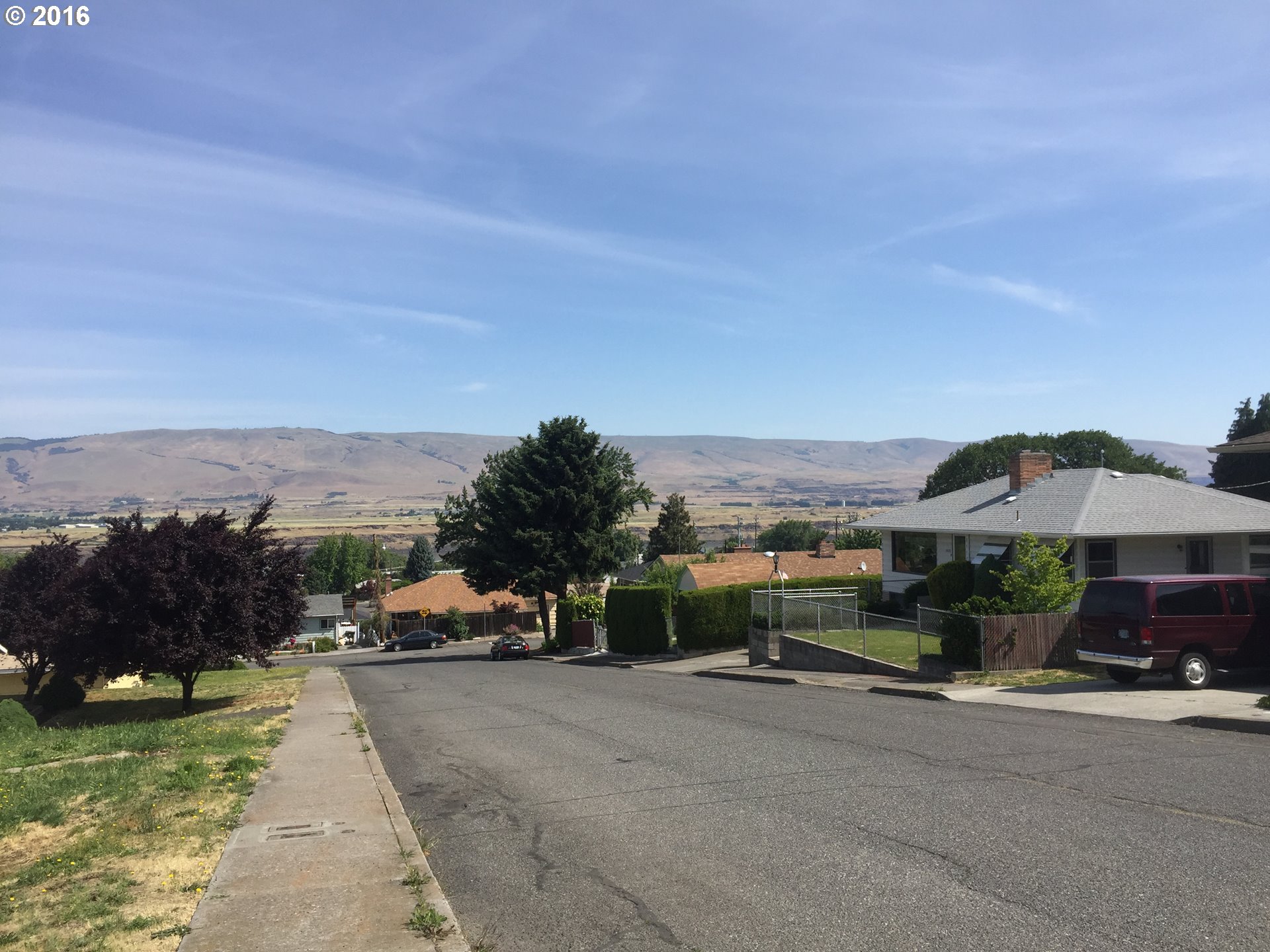 1609 Nevada Street The Dalles, OR 97058 - Photo 5 of 24 a view of city street with a car parked