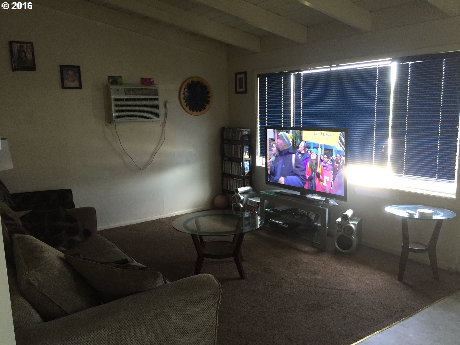 1609 Nevada Street The Dalles, OR 97058 - Photo 7 of 24 a living room with furniture and a flat screen tv