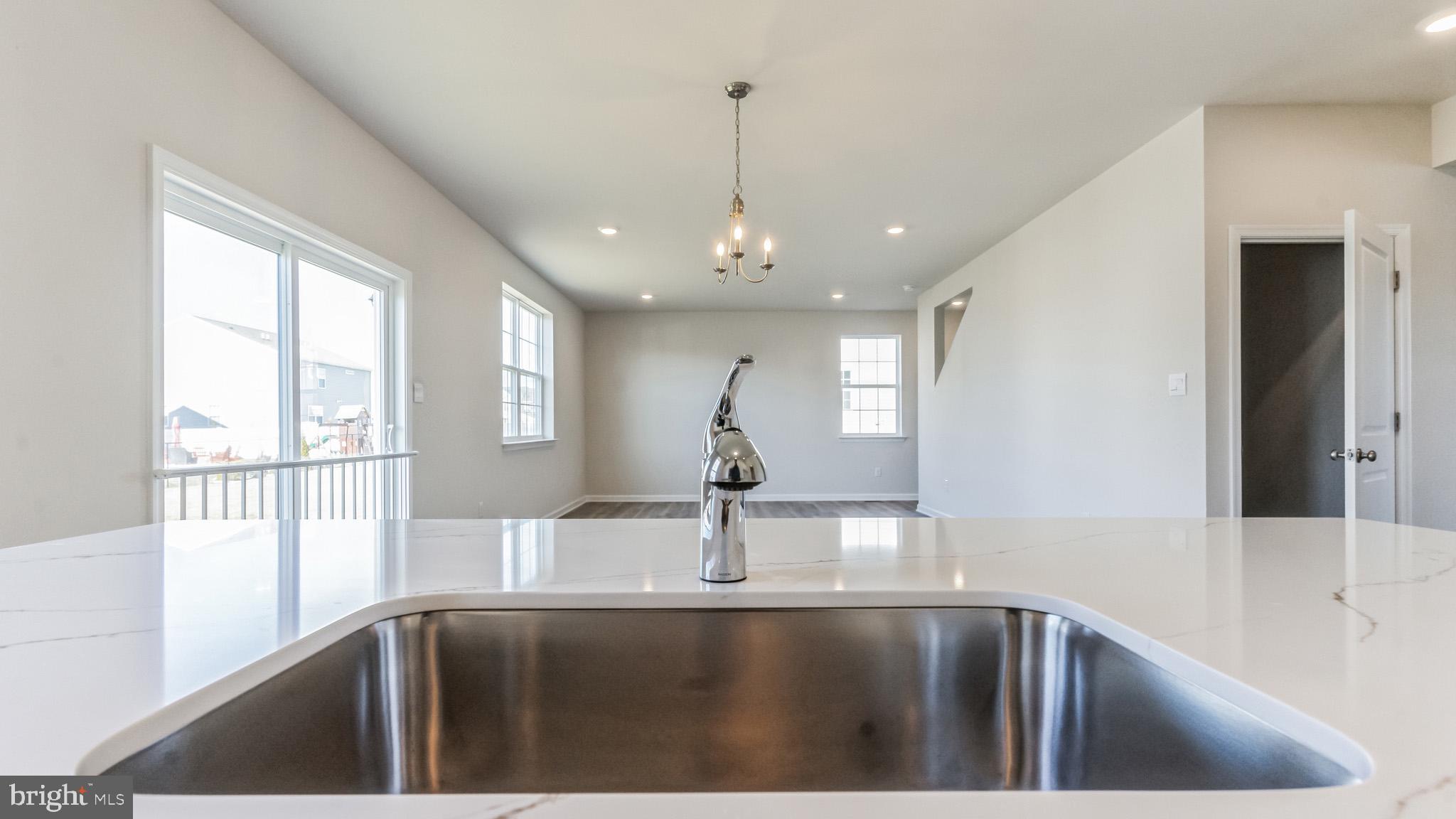 423 Kingston Drive Cherry Hill, NJ 08034 - Photo 11 of 27 a kitchen with a sink and a window