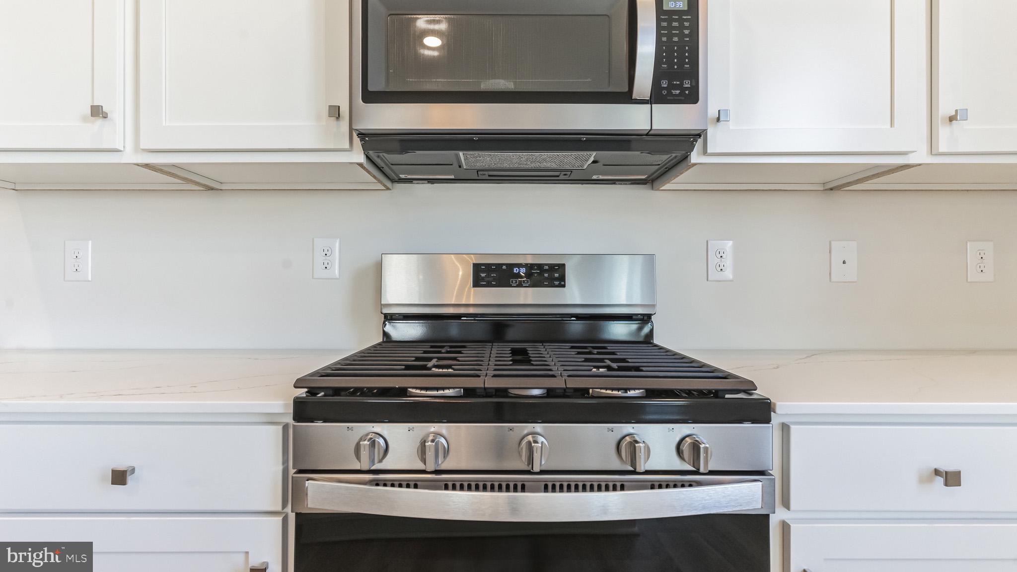 423 Kingston Drive Cherry Hill, NJ 08034 - Photo 12 of 27 a stove top oven sitting inside of a kitchen