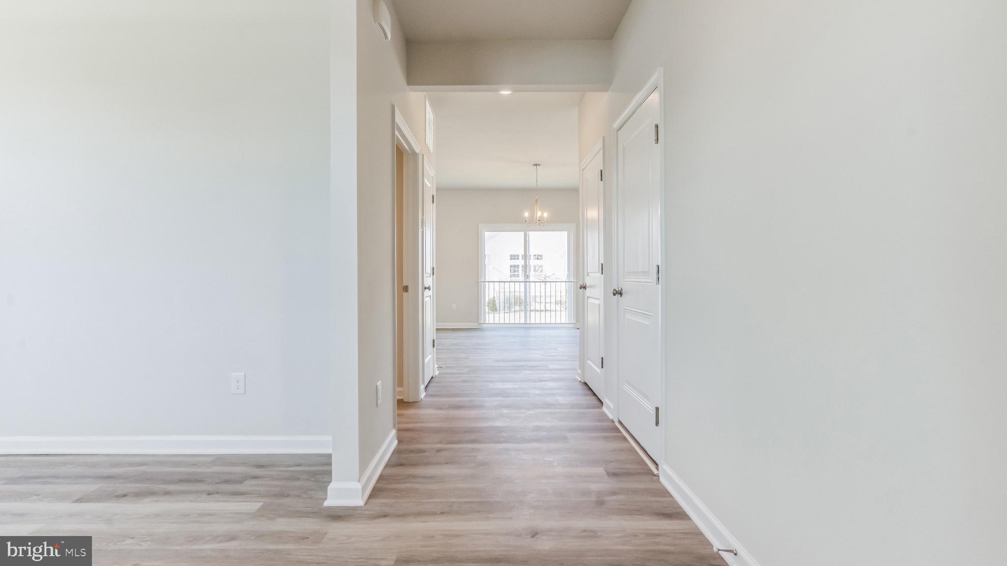 423 Kingston Drive Cherry Hill, NJ 08034 - Photo 4 of 27 a view of a hallway with wooden floor