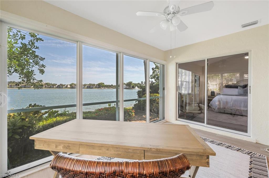 2604 Sailors Way, Unit 120 Naples, FL 34109 - Photo 24 of 27 a room with pool table and windows