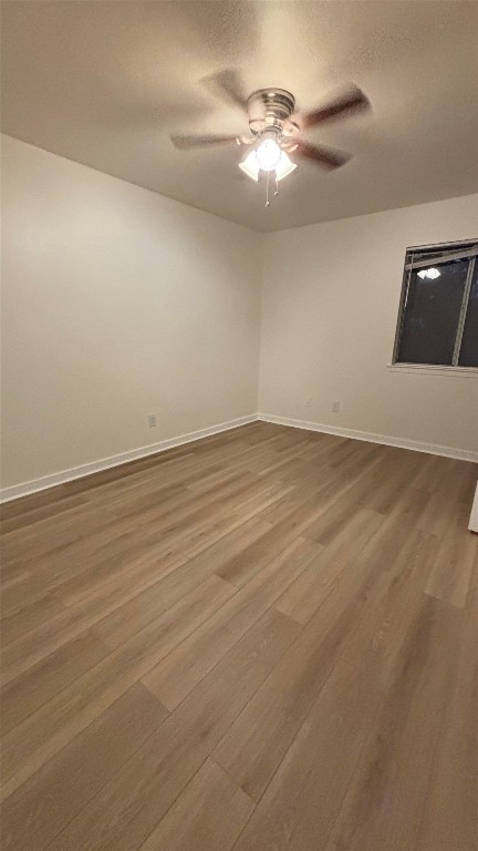 4507 Dorsett Oaks Circle, Unit A Austin, TX 78727 - Photo 11 of 26 Bedroom with light wood-style flooring, and ceiling fan.