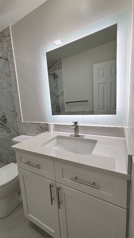4507 Dorsett Oaks Circle, Unit A Austin, TX 78727 - Photo 17 of 26 Bathroom featuring a marble finish shower and vanity