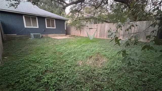 a backyard of a house with lots of green space